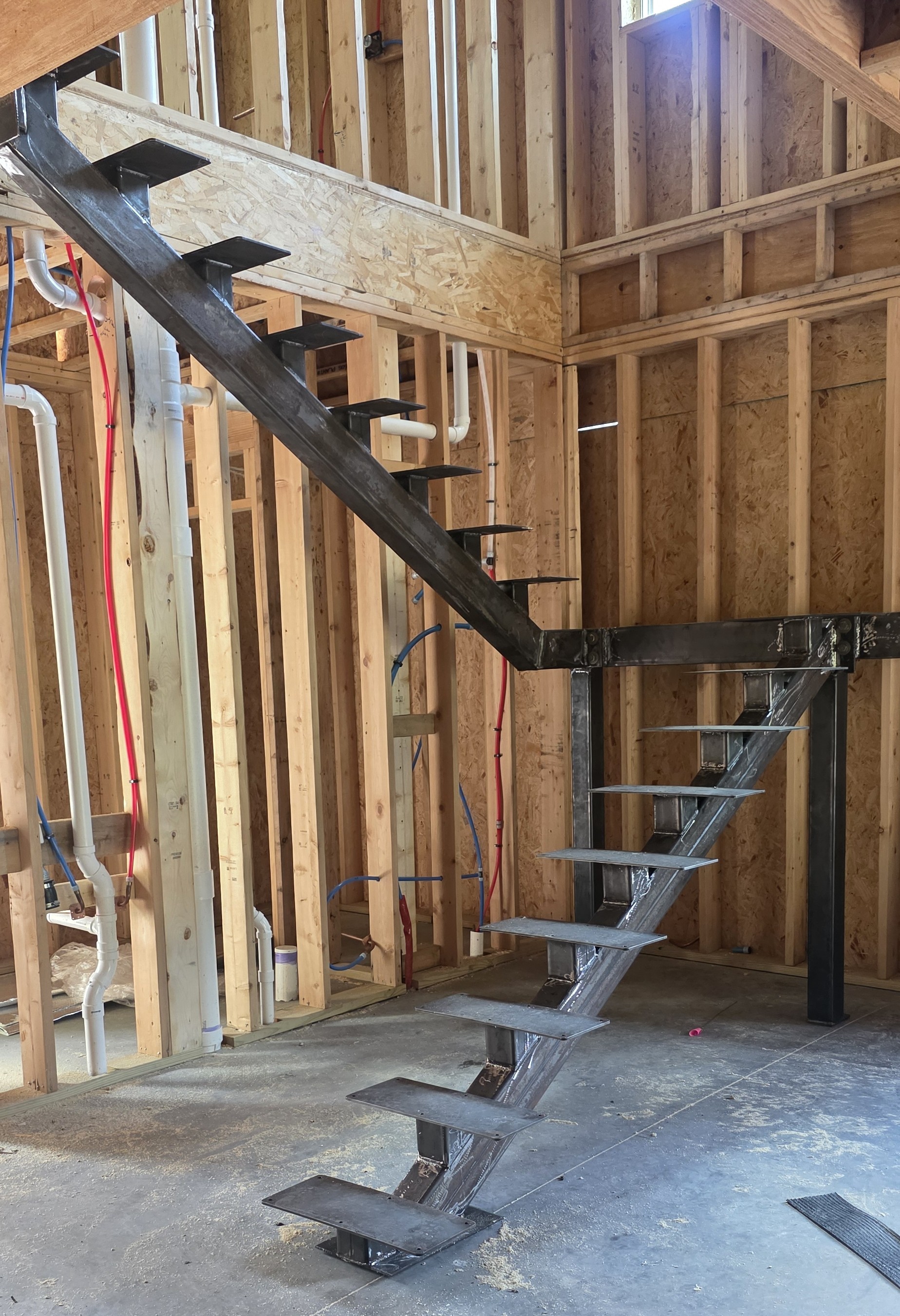 Custom floating steel staircase installation