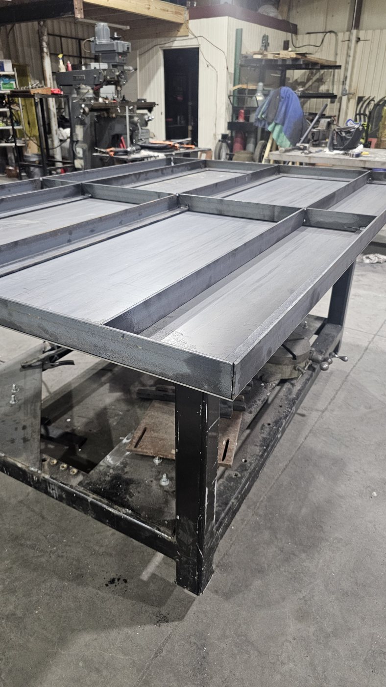 Unpainted steel skid top view in the shop