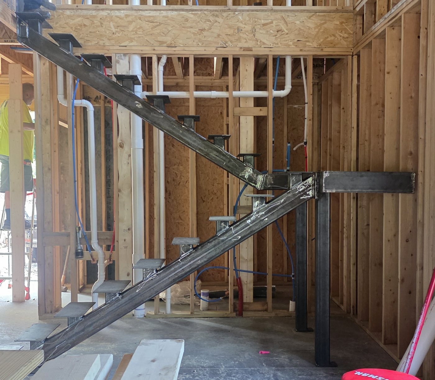 Floating staircase installation close-up on site