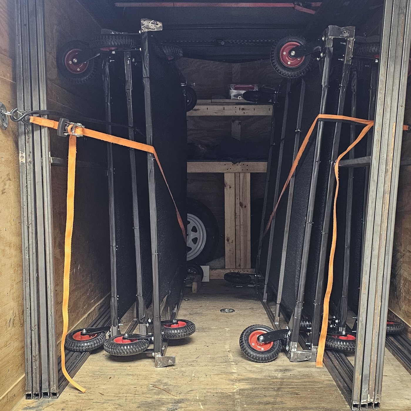 Frames folded flat and packed into the equipment trailer