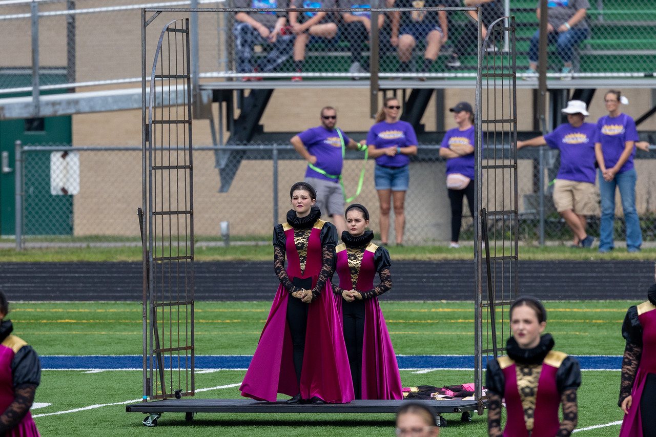 Performers on the oversized throne prop with integrated steps at MCMB Queen of Kings